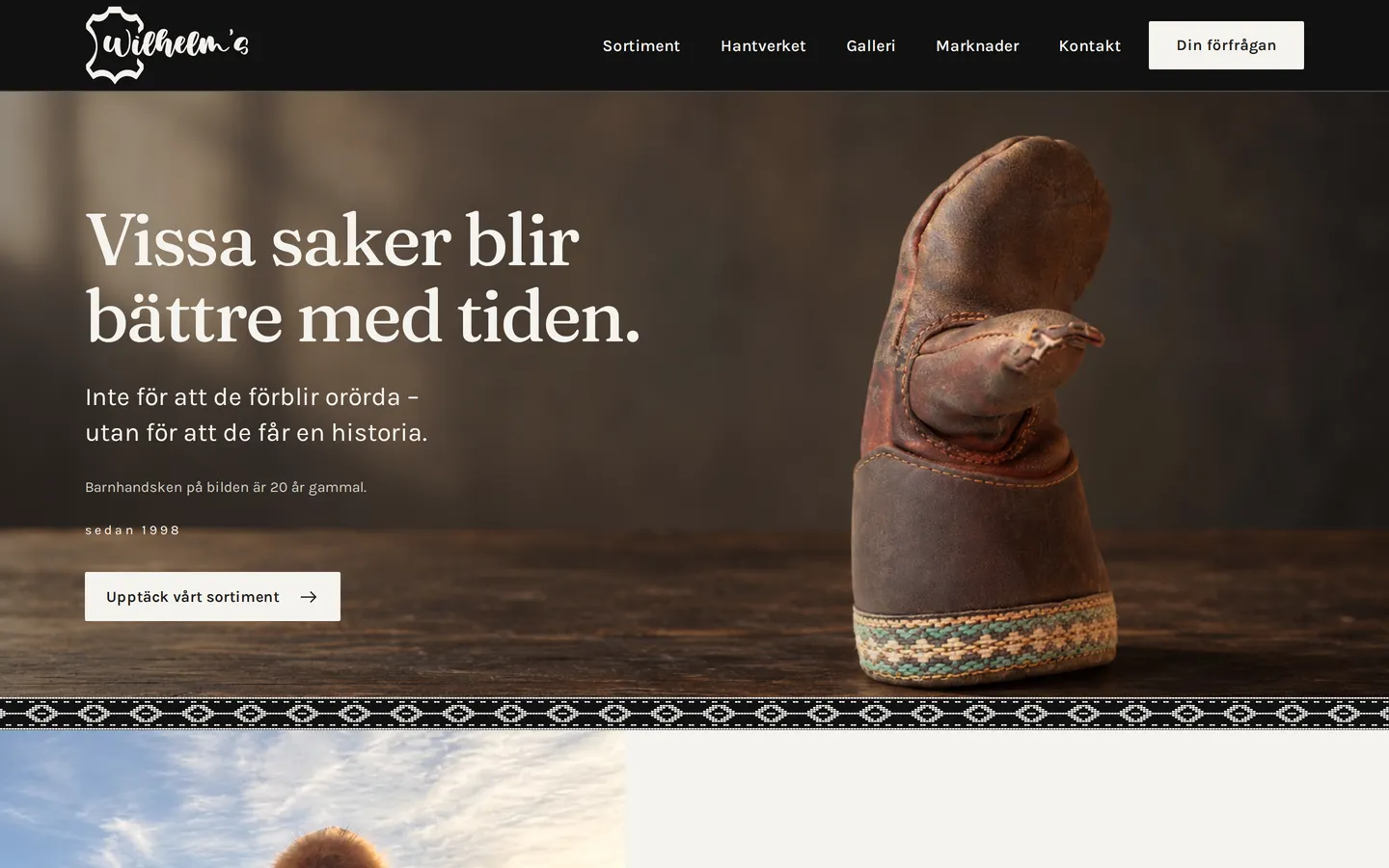 Startsidan för Wilhelm's i en dator: en sliten barnhandske och rubriken Vissa saker blir bättre med tiden.